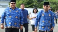 Bupati Simalungun, Dr. H. Anton Achmad Saragih, didampingi Sekda Simalungun Mixnon Simamora saat hadiri HKN.