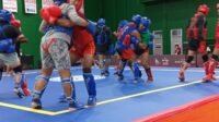 Coba Lapangan: Para pewushu Sumut mencoba panggung / ring Sanda yang akan digunakan di PON Bela Diri II/2025 di GOR Djarum Kaliputu Kudus. Jateng