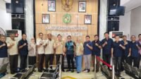 PWPM dan Bapenda Kepala Bapenda Kota Medan, M Agha Novrian diabadikan bersama pengurus Koordinator PWPM Muhammad Edison Ginting beserta jajaran pengurus usai beraudiensi di kantor instansi tersebut, Selasa (12/5/2026).