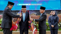 Gubernur Sumatera Utara (Sumut) Muhammad Bobby Afif Nasution, Wakil Gubernur Sumut Surya, Pj Sekdaprov Sumut Sulaiman Harahap, bersama seluruh OPD, menghadiri Rapat Paripurna Penyerahan Laporan Hasil Pemeriksaan (LHP) BPK RI atas LKPD Provinsi Sumut Tahun Anggaran 2025 di Gedung DPRD Sumut, Jalan Imam Bonjol, Medan, Kamis (25/6/2026).